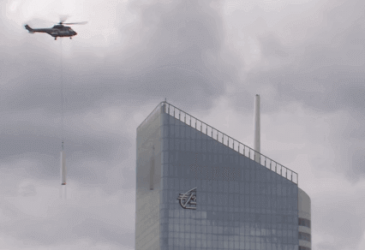 Installation of the Incity tower spire by helicopter