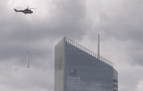 Installation of the Incity tower spire by helicopter